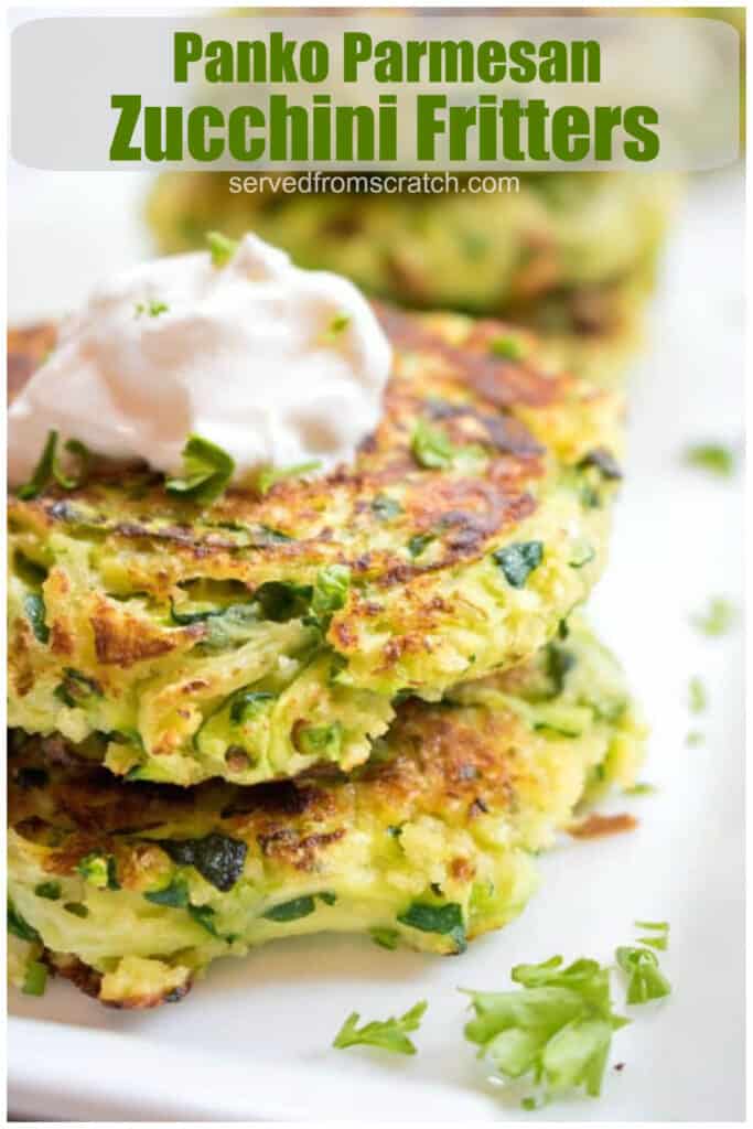 a close of up of stacked zucchini fritters topped with sour cream with Pinterest pin text.
