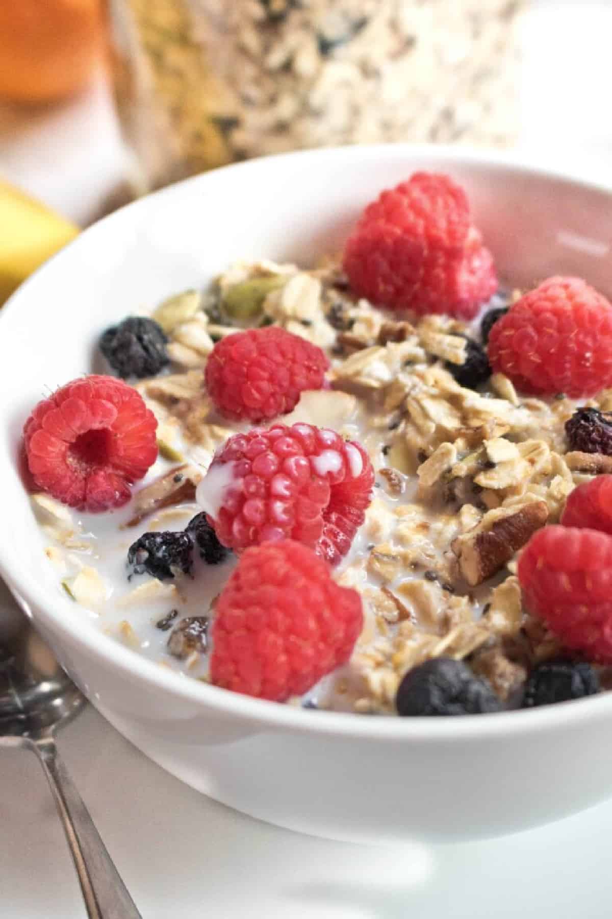 a bowl of muesli with fresh fruit on top.