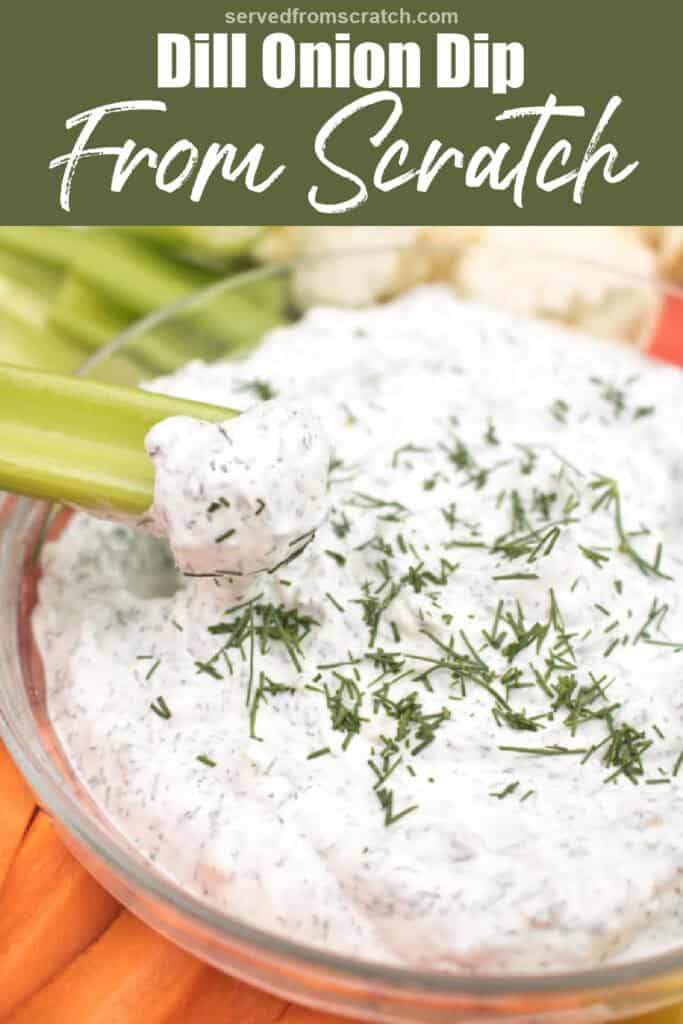 a bowl of dip and a celery dipping in it.