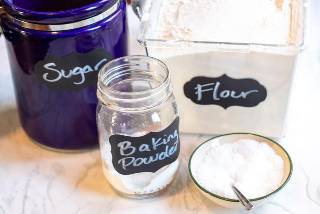 sugar, flour, baking powder, and salt on a counter 