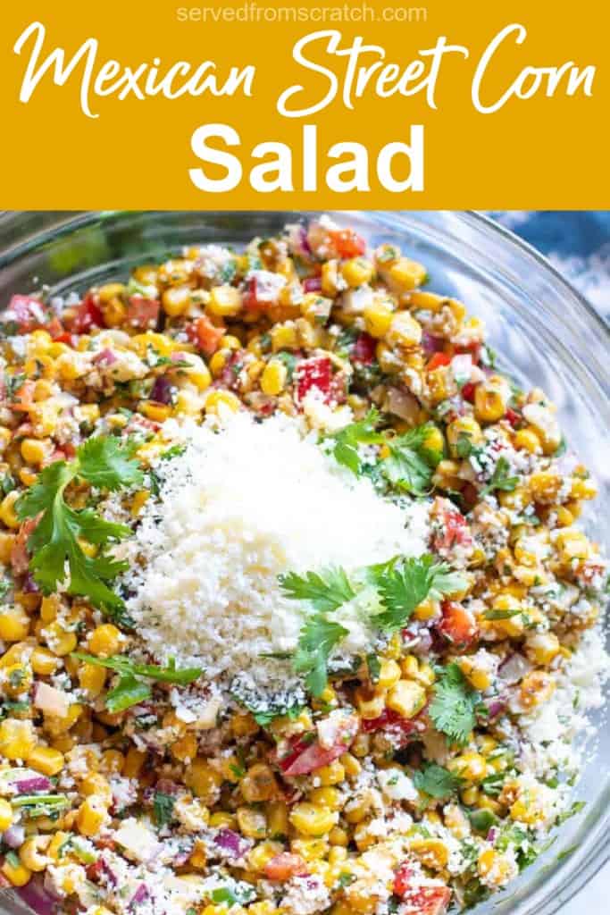 a bowl of mexican street corn salad topped with cheese and Pinterest pin text.