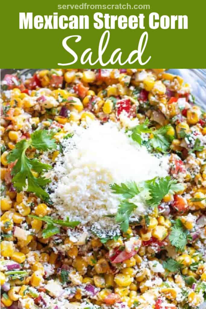 a close up of Mexican street corn salad with a pile of cotija and Pinterest pin text.