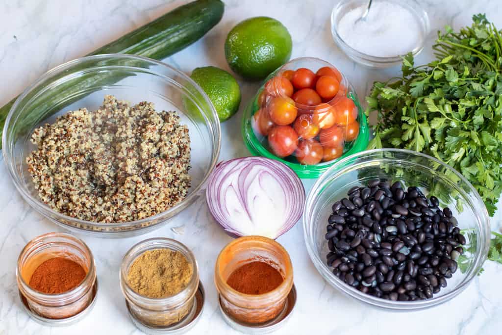 ingredients for black bean quinoa salad on a counter 