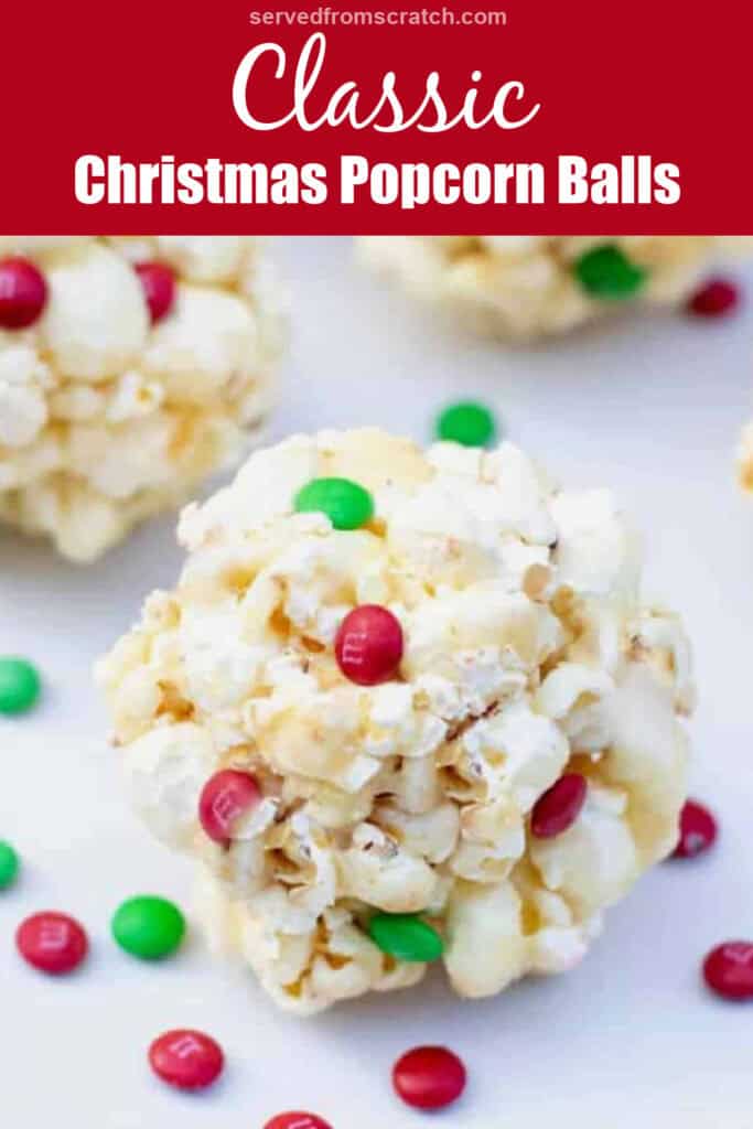 a popcorn ball with christmas colored mini m&ms with Pinterest pin text.