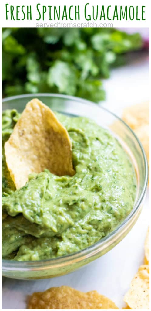 a bowl of guacamole with a chip and Pinterest pin text.