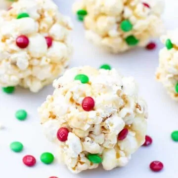 It's a childhood favorite! These Christmas inspired Easy Classic Popcorn Balls are a super fun treat to make for the holidays!