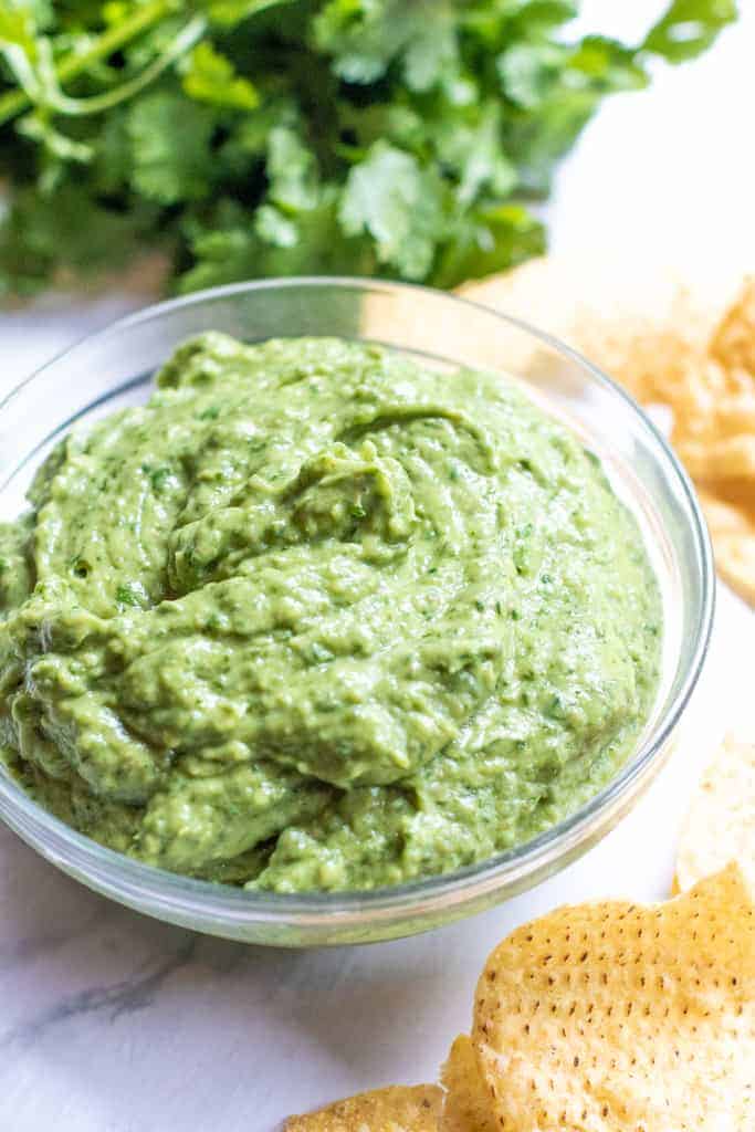 This Fresh Spinach Guacamole takes the classic dip and makes it even healthier by adding some fresh spinach while keeping the classic guacamole flavors!