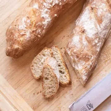 This Easy Crusty French Baguette is simple enough to be made at home but tastes just like you bought it at your local bakery! #recipe #easy #frenchbaguette #french #baguette