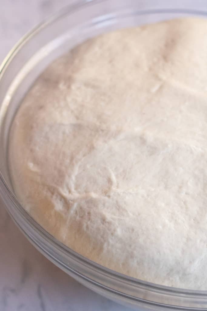 dough rising in a bowl.