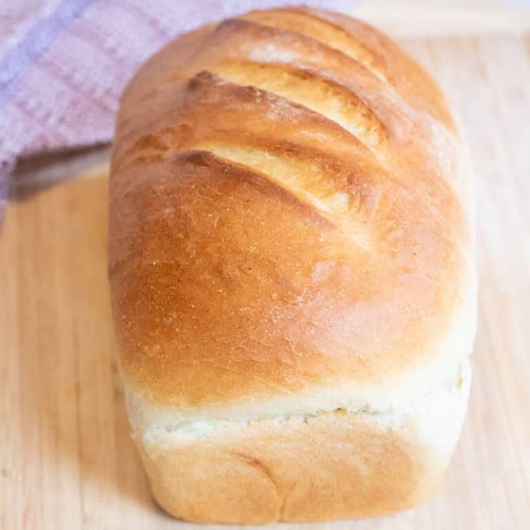 a baked loaf of white bread.