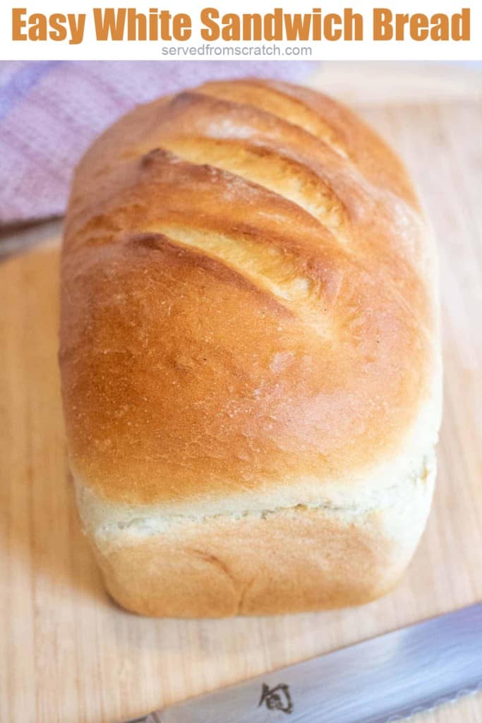 a loaf of white bread on a cutting board with Pinterest pin text.