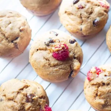 raspberry chocolate chip muffins on a cooling rack.