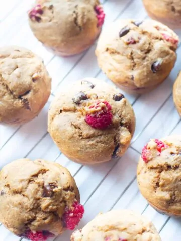 raspberry chocolate chip muffins on a cooling rack.