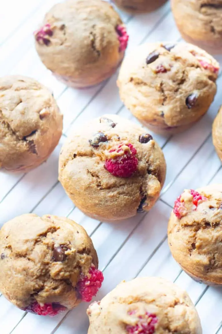 raspberry chocolate chip muffins on a cooling rack.