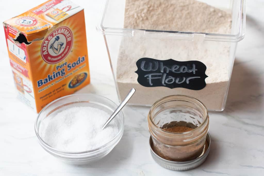 baking soda, salt, whole wheat flour ground cinnamon on counter