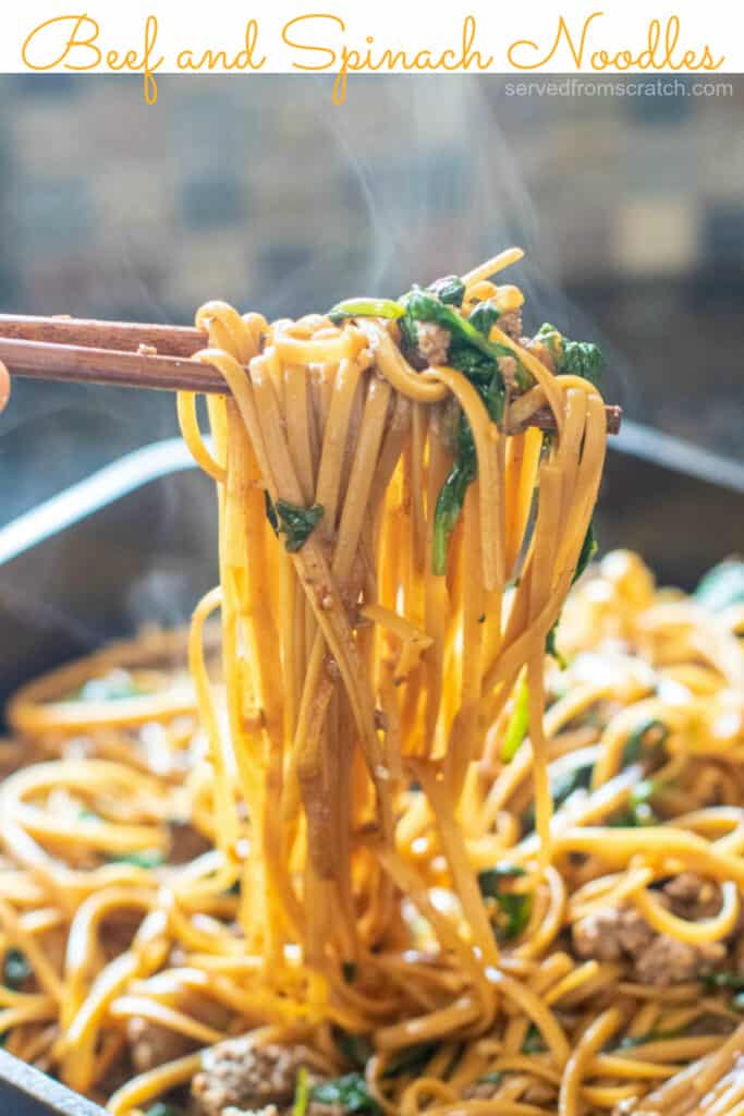 beef and spinach noodles in chopsticks with Pinterest pin text.