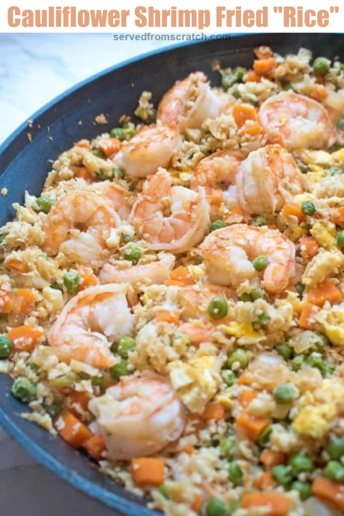 a pan of cooked shrimp, peas, carrots, eggs, and cauliflower rice with Pinterest pin text.