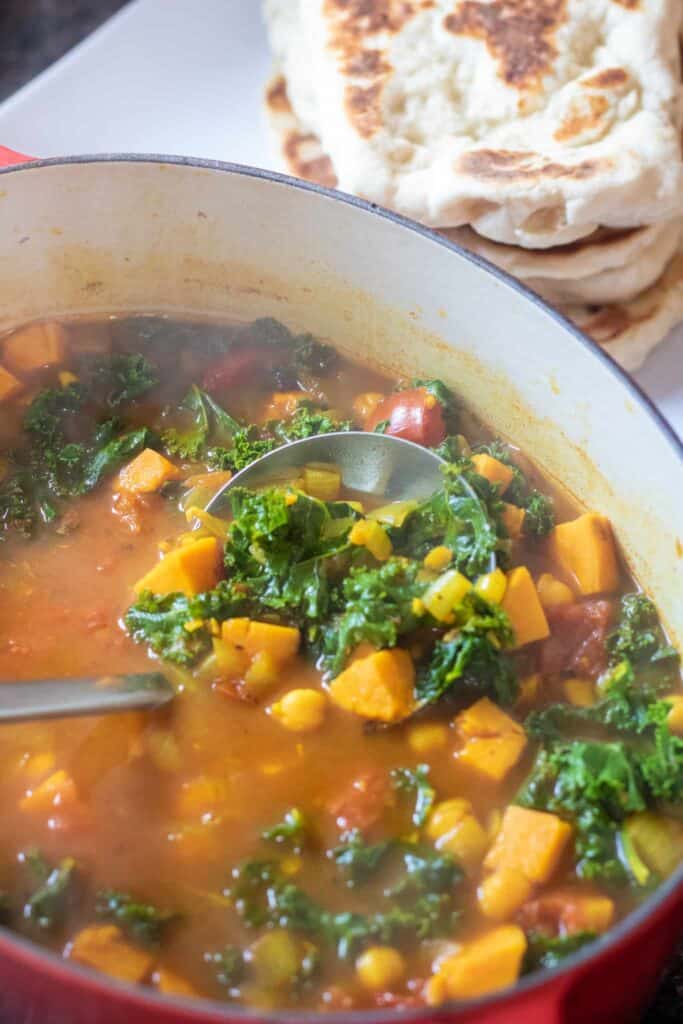 This Chickpea Kale Curry Soup is an incredibly healthy and easy to make soup that's full of flavor, packed with nutrition and still family friendly! #soup #chickpeakalecurrysoup #cleaneating #vegetarian #vegan #glutenfree
