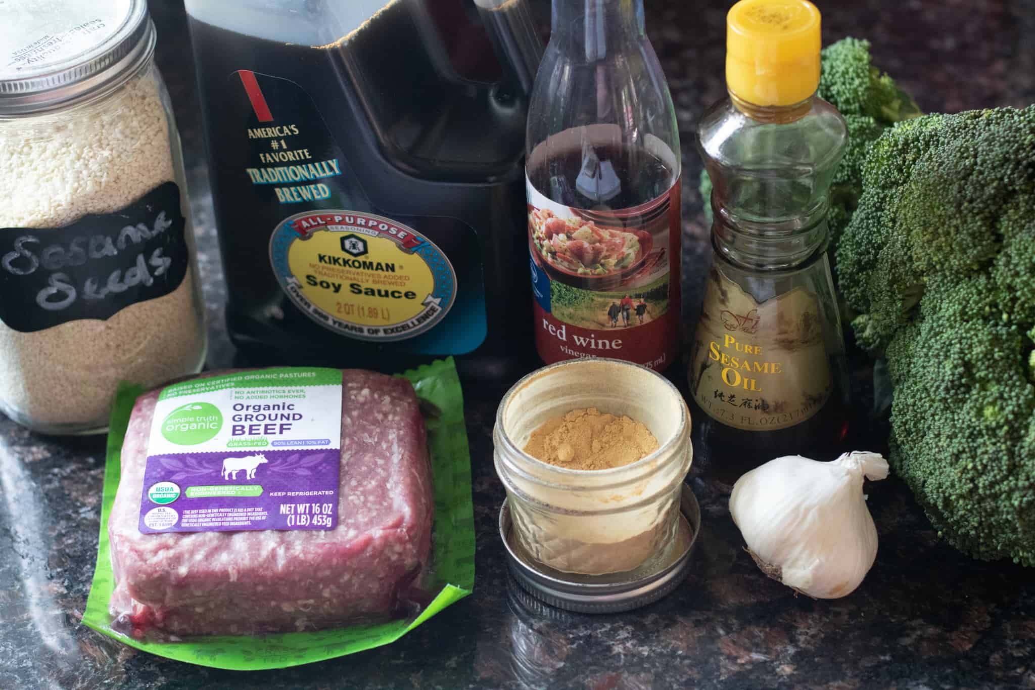 Ingredients for ground beef and broccoli laid out on a counter.