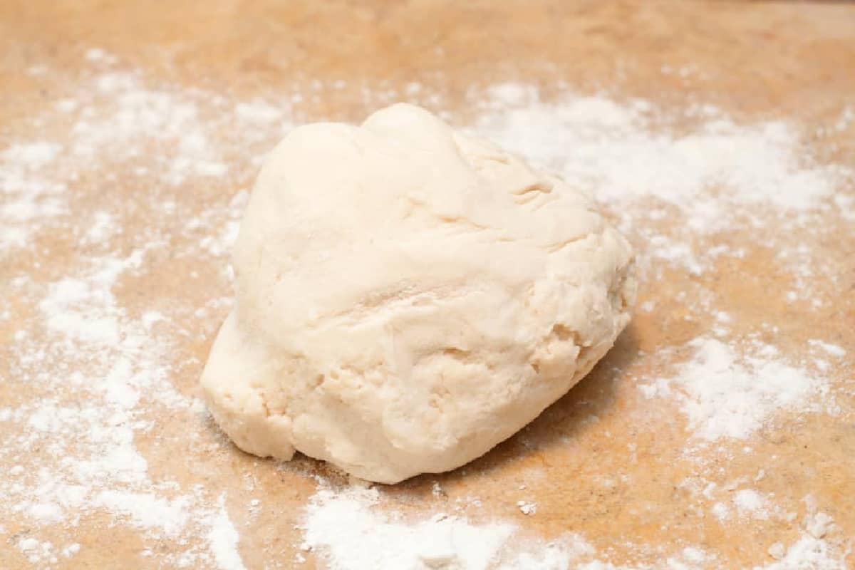 a ball of dough on a floured counter.