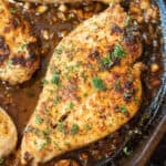 cooked chicken breast in butter and with parsley.