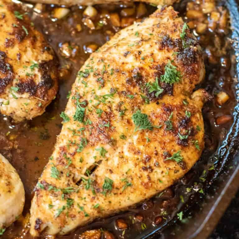 cooked chicken breast in butter and with parsley.