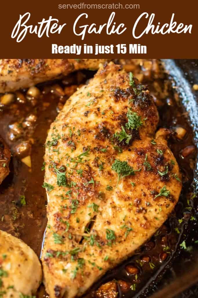 a cooked chicken breast in a pan topped with seasonings and parsley with Pinterest pin text.