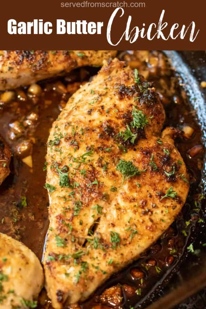 cooked garlic butter chicken in a pan with fresh parsley with Pinterest pin text.