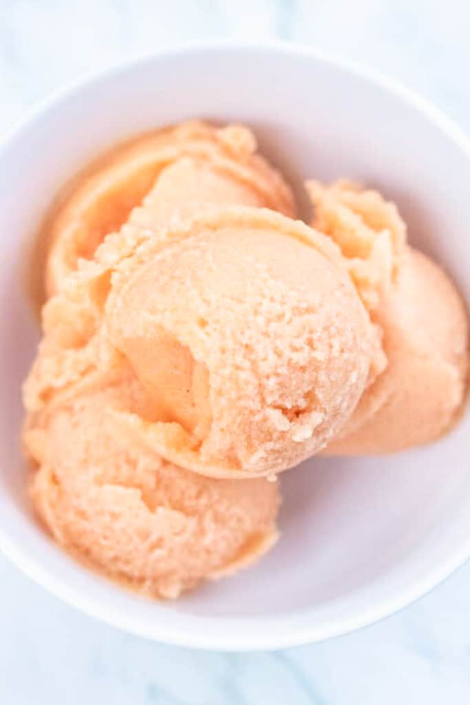a bowl of peach sorbet.