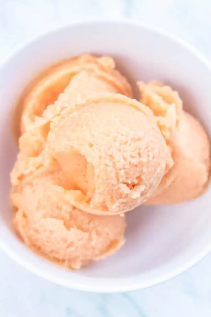 a bowl of peach sorbet.