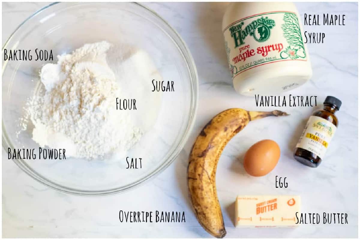 bowl of flour, sugar, baking soda and powder, banana, egg, butter, maple, vanilla extract.