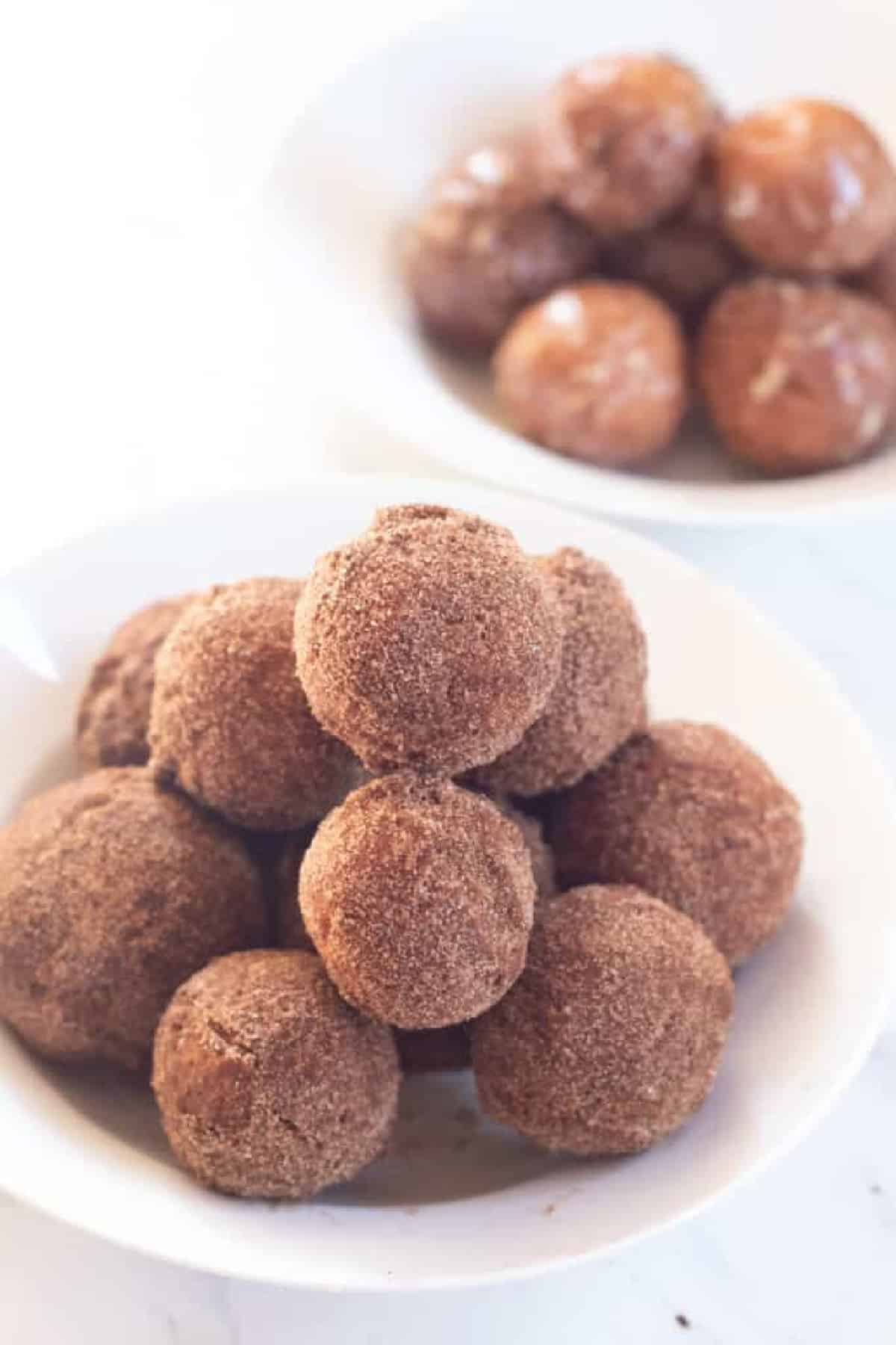 a bowl of sugar coated donut holes.
