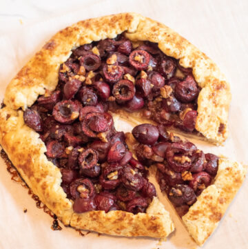 baked cherry galette with a slice cut out