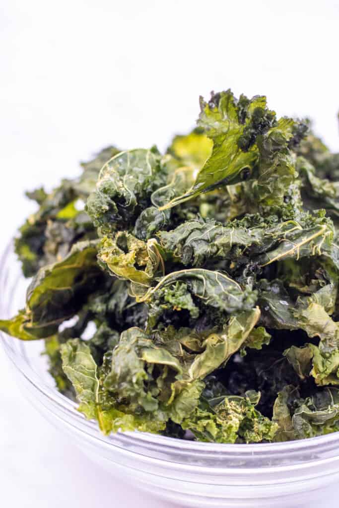 a bowl of crispy kale chips