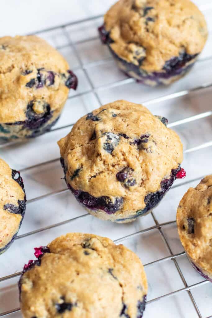 blueberry muffins on a cooling rack