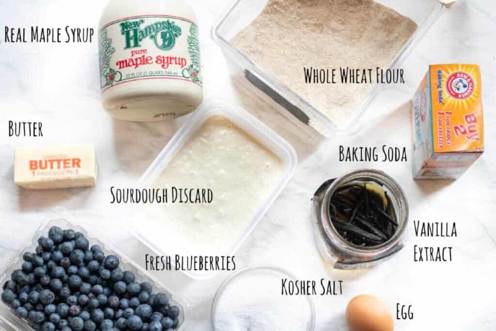 ingredients for sourdough blueberry muffins on a counter.