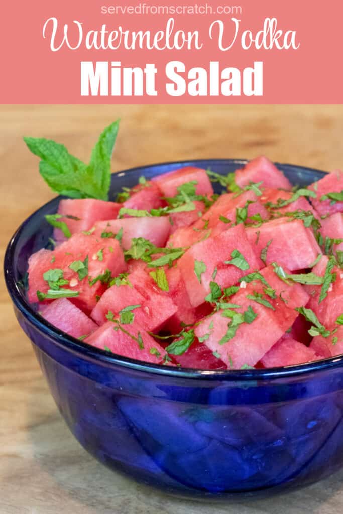 a blue bowl of cubed vodka with mint with Pinterest pin text.