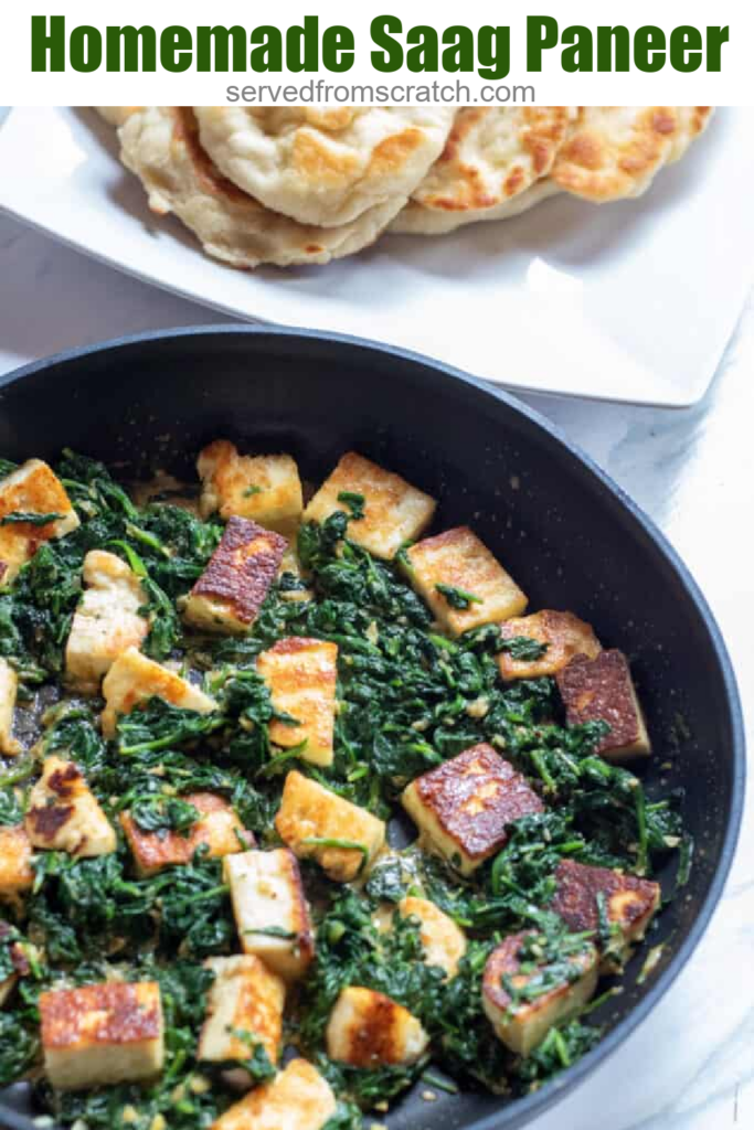 spinach in a pan with seared paneer..