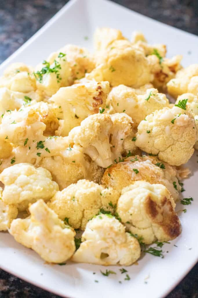 cheesy roasted cauliflower on a plate