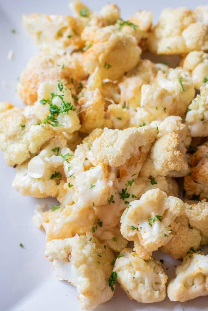 cheesy roasted cauliflower on a plate