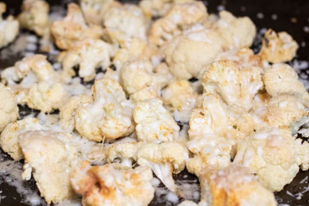 cheesy cauliflower on a baking sheet