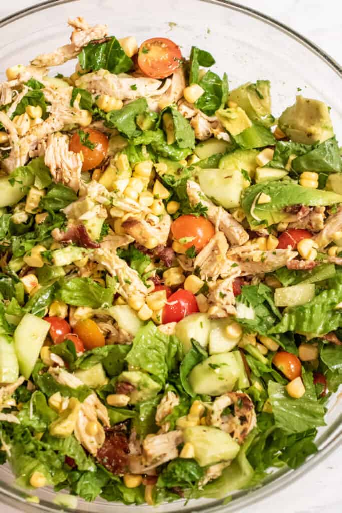 an overhead of a big bowl of green chicken salad