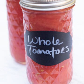 2 mason jars of whole tomatoes.