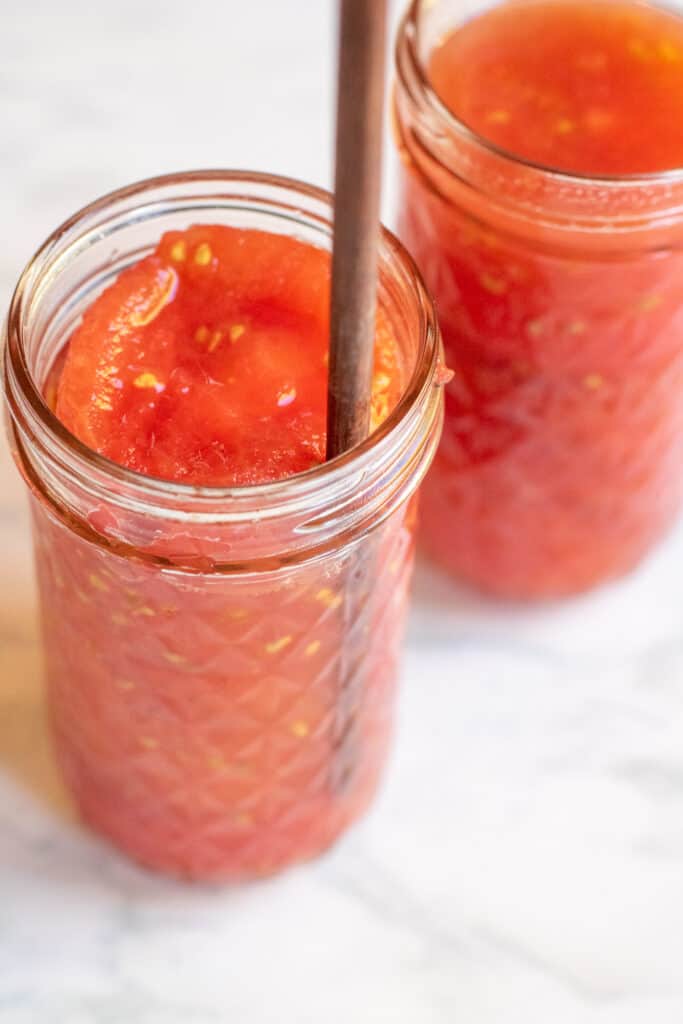 chopsticks removing bubbles from mason jar