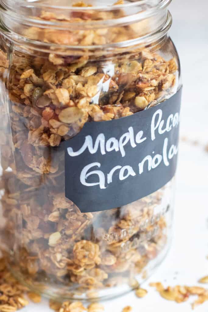 a close up of a mason jar of granola 