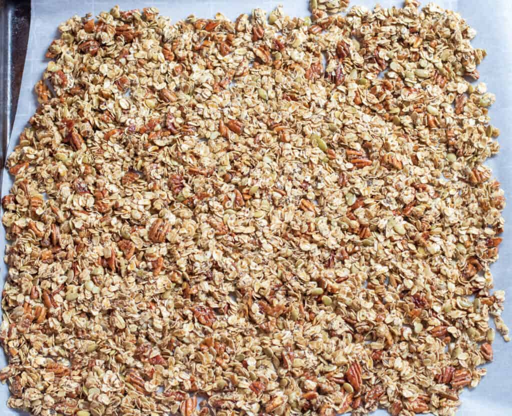 a sheet pan of unbaked pecan granola