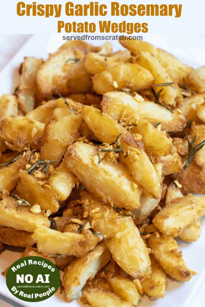 a plate of wedges of potatoes crisped with rosemary and garlic with Pinterest pin text with NO AI Sticker.