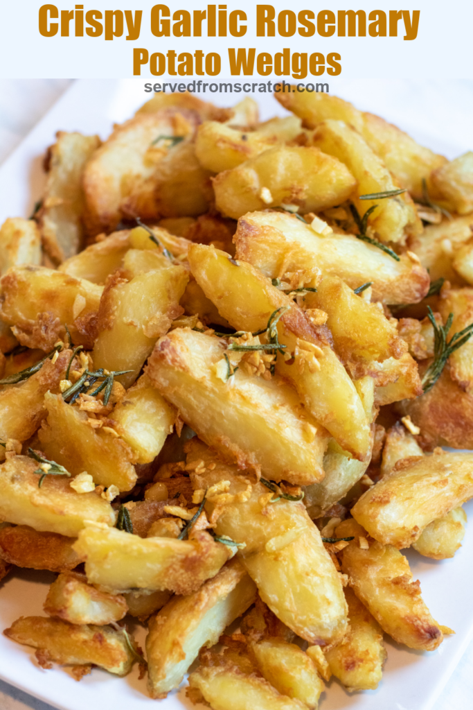 a plate of wedges of potatoes crisped with rosemary and garlic with Pinterest pin text.