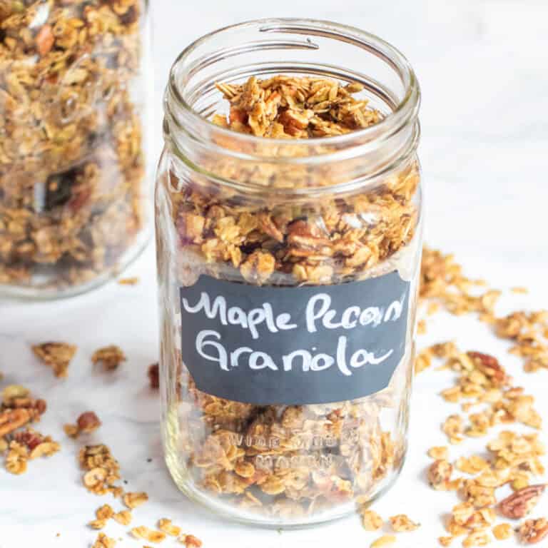 a picture of a large labeled mason jar with granola.