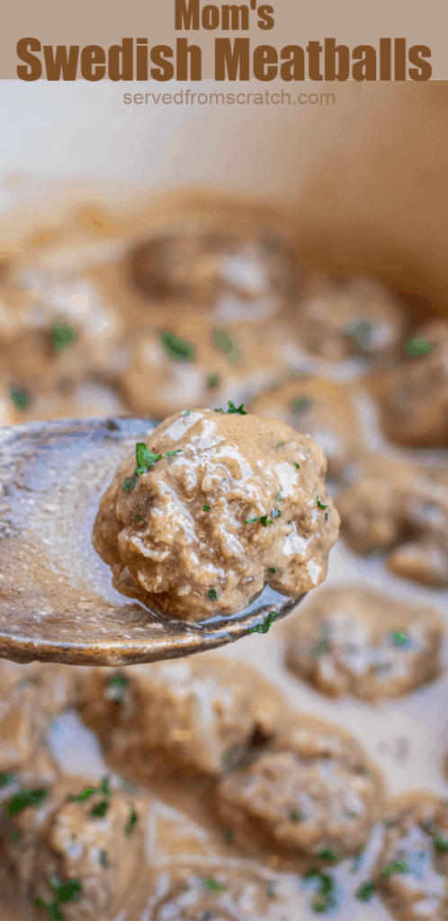 a wooden spoon holding up a swedish meatball over a pot of meatballs with Pinterest pin text.